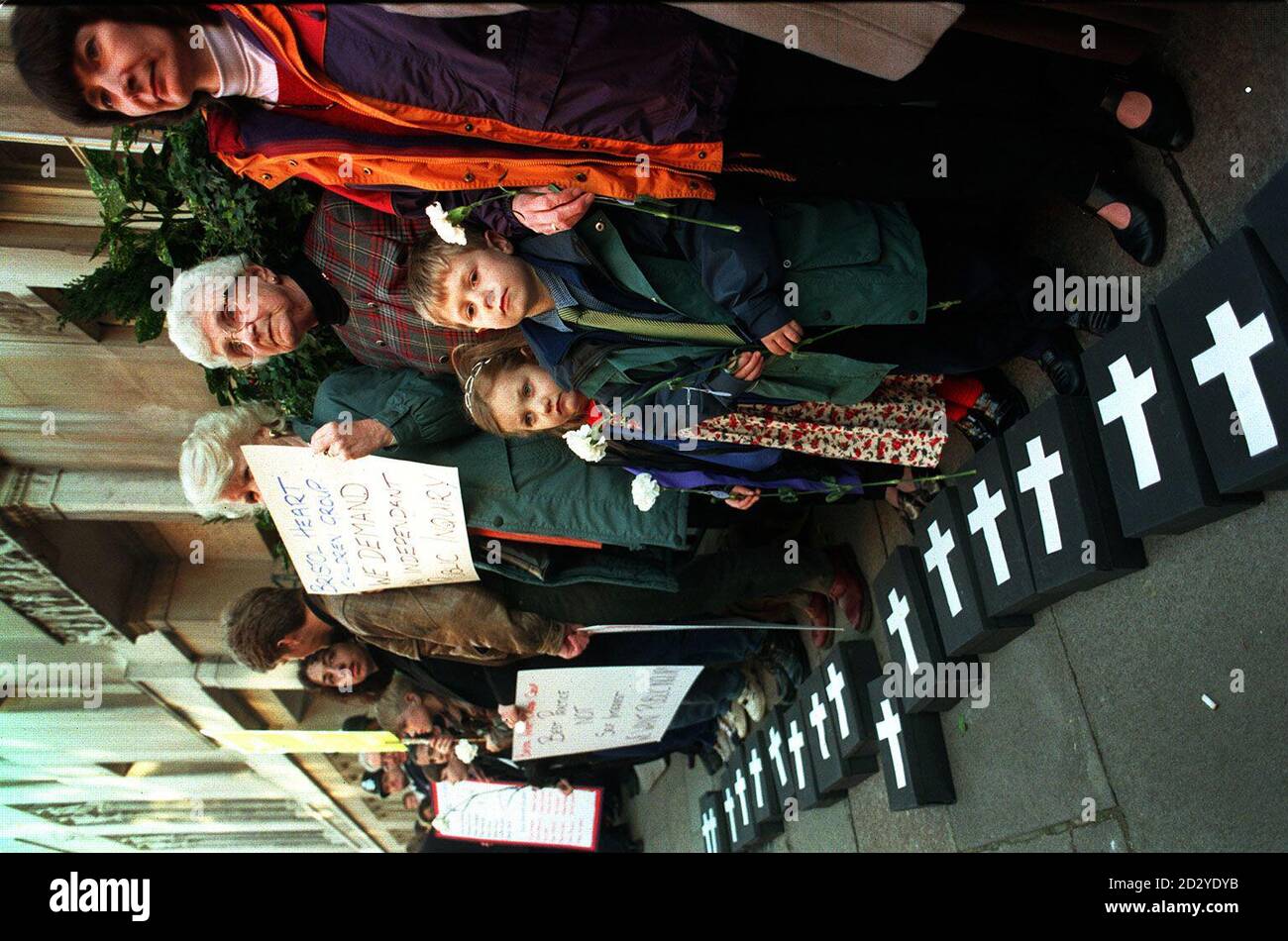 Protestors stand outside the General Medical Council, in London, with other families and their supporters who are demanding a public inquiry into why 68 children have died or been left brain damaged following heart surgery at Bristol Royal Infirmary * Zoe, 5 and Jordan Curnow, 6 - whose 9 month-old sister, Verity, died after undergoing heart surgery at the hospital. Stock Photo