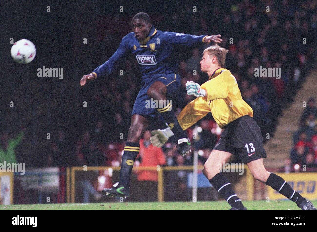 Wimbledon's Carl Leaburn makes an attempt on goal as he nods past Arsenal keeper Alex Manninger, during tonight's (Wed) Premiership match at Selhurst Park. Photo by Tony Harris/PA Stock Photo