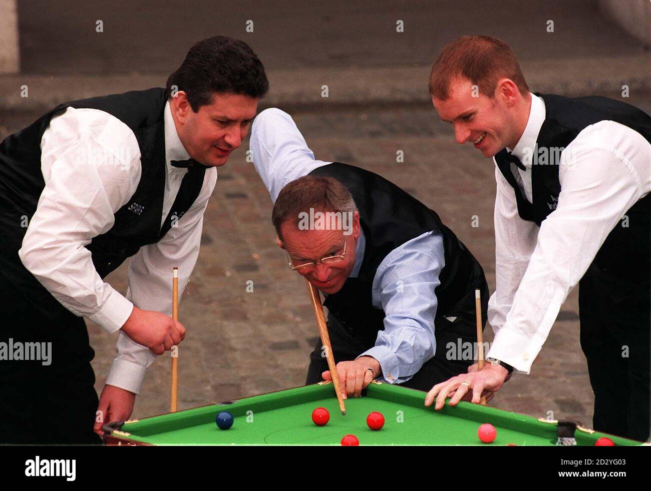 World-class snooker players, Tony Drago (left) and Peter Ebdon (right), join Lord Archer (centre) to launch a unique snooker initiative, Team Sparks, in central London today (Monday)
