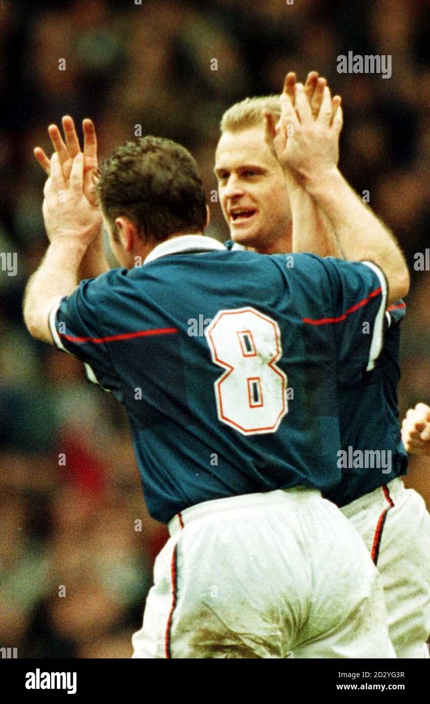 Ally McCoist (No.8) congratulates Jonas Thern after scoring for Ranger's during this afternoon's (Saturday) Bells's Scottish League clast against St.Johnstone at Ibrox. Rangers defeated  St. Johnstone 2-1. Photo by Chris Bacon/PA Stock Photo