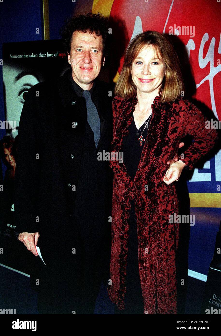 PA NEWS PHOTO 3/4/98 AUSTRALIAN ACTOR GEOFFREY RUSH AND HIS ACTRESS WIFE, JANE MENELAUS, ATTEND THE FILM PREMIERE OF 'SCREAM 2' AT THE VIRGIN CINEMA, FULHAM ROAD, LONDON Stock Photo