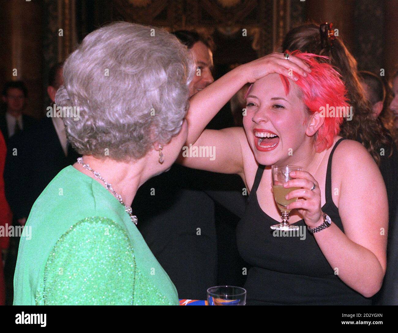 Britain's Queen Elizabeth II chats with Julie Thompson a vocalist with the 1st Rock Band to perform at Buckingham Palace. The performance took place at a concert after an official dinner for the Asia-European leaders this evening (Friday). Photo by Adam Butler/PA (WPA Rota pic) Stock Photo