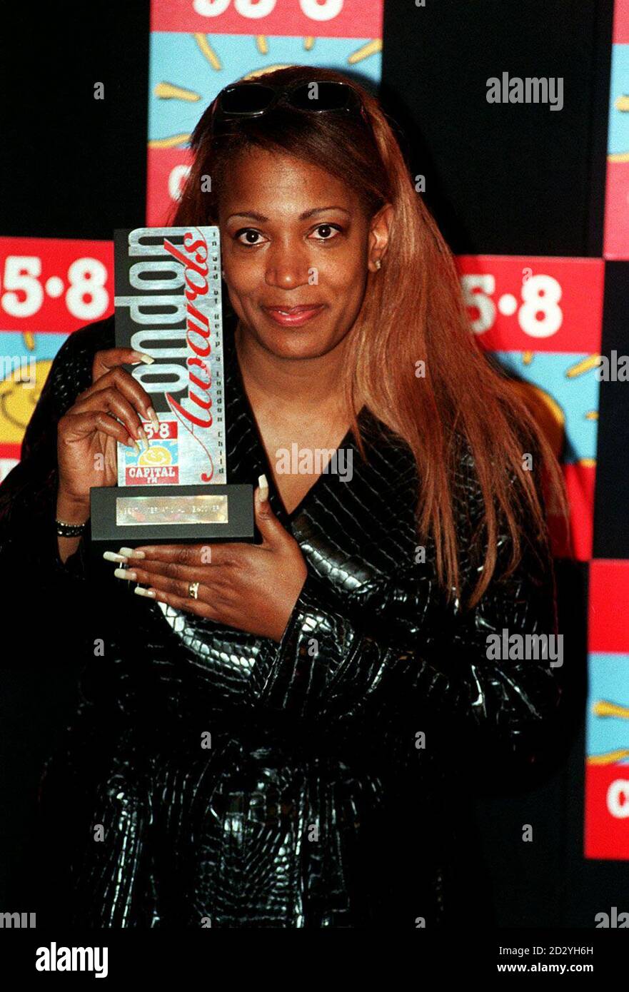 PA NEWS PHOTO 8/4/98 Singer Lutricia McNeal with the Capital Radio 95.8  Award for "Best International Newcomer" presented to her at the Royal  Lancaster Hotel in London this afternoon (Wednesday). Photo by