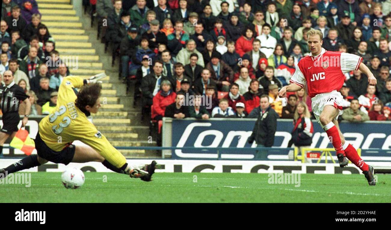 Arsenal's Dennis Bergkamp (right) blasts in Arsenal's first goal against Blackburn Rovers at Ewood Park today during their FA Carling Premiership match. Photo by Brian Williamson/PA. Stock Photo