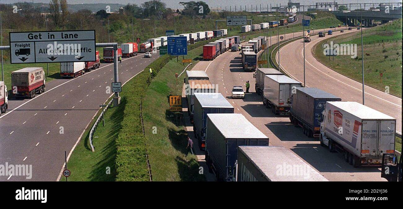 Hundreds of trucks wait their turn to enter the port of Dover on the M20 at Folkestone, Kent as delays of up to eight hours on Channel crossings contined because of a 'wildcat' strike by French seafarers which has closed the port of Calais. Stock Photo