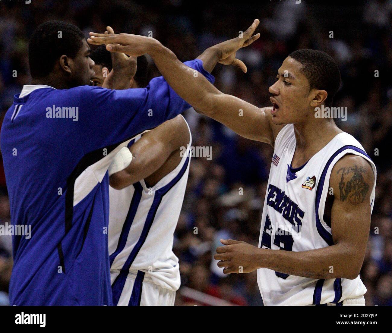 Memphis Tigers Derrick Rose (R) slaps hands with teammates during the  second half of their NCAA Men's Final Four championship basketball game  against the Kansas Jayhawks in San Antonio, Texas, April 7,