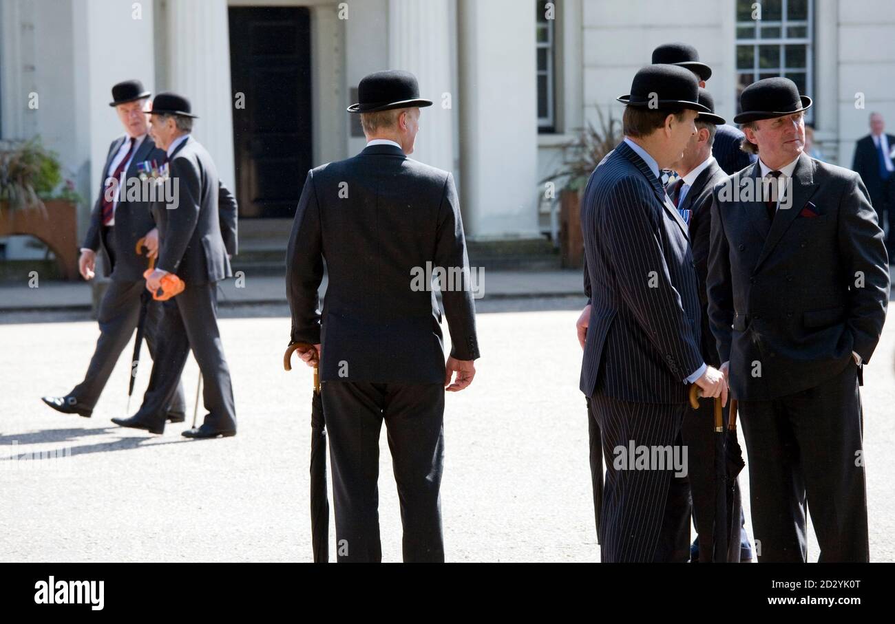 Men wearing bowler hats and carrying umbrellas at a military parade in  London May 11, 2008. REUTERS/Kevin Coombs (BRITAIN Stock Photo - Alamy