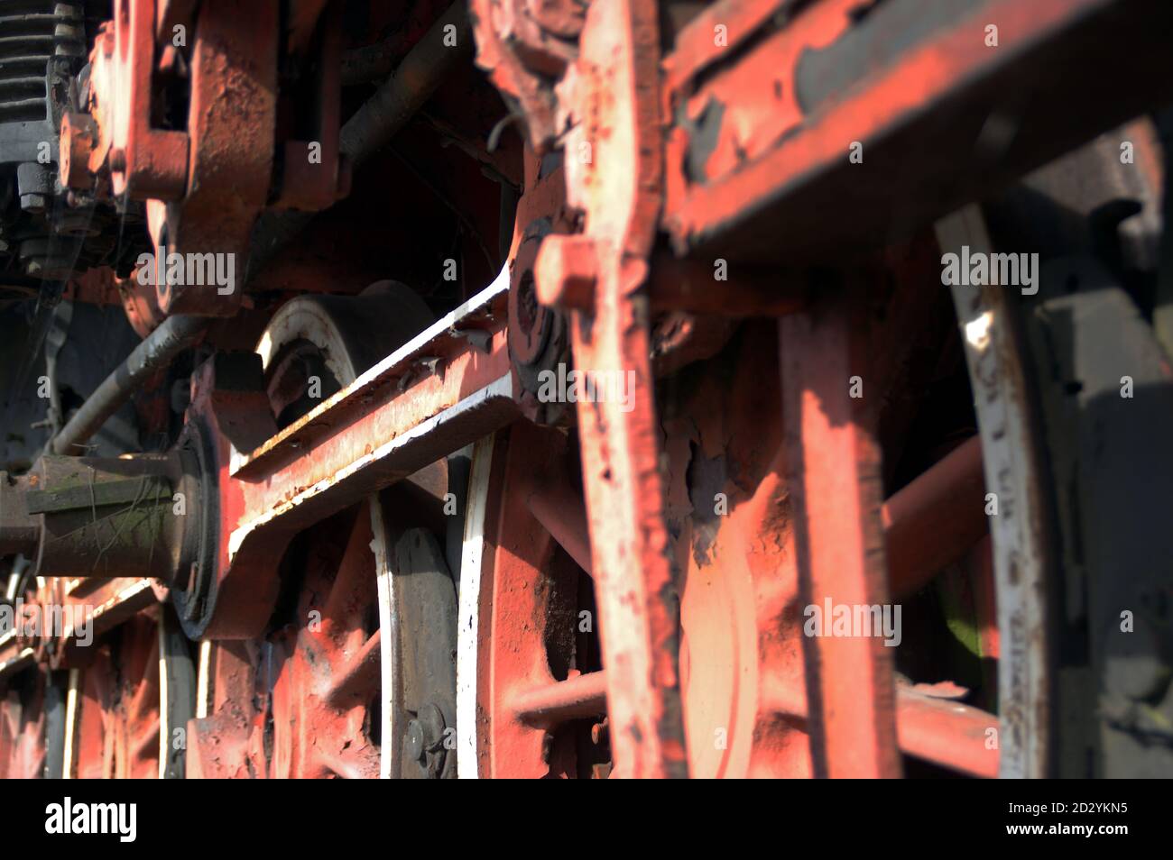 Red vintage train wheels. Retro locomotive part. Stock Photo