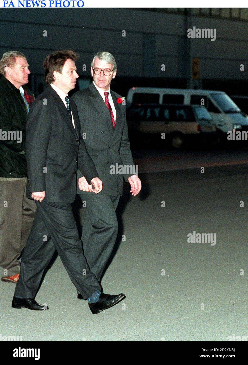 Prime Minister John Major leads Tony Blair to the plane at RAF Northholt, heading to Israel with Paddy Ashdown for the funeral of Yitzhak Rabin. Stock Photo