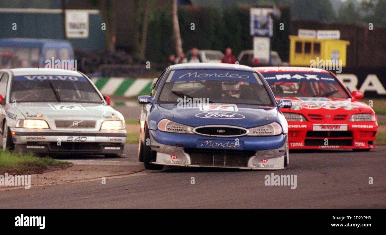 Former Formula One Champion Nigel Mansell found himself back in the lead for several laps of the Donington Park curcuit today (Sunday) while leading round 12 of the Auto Trader RAC British Touring Car Championship. Photo by Derek Cox/PA Stock Photo