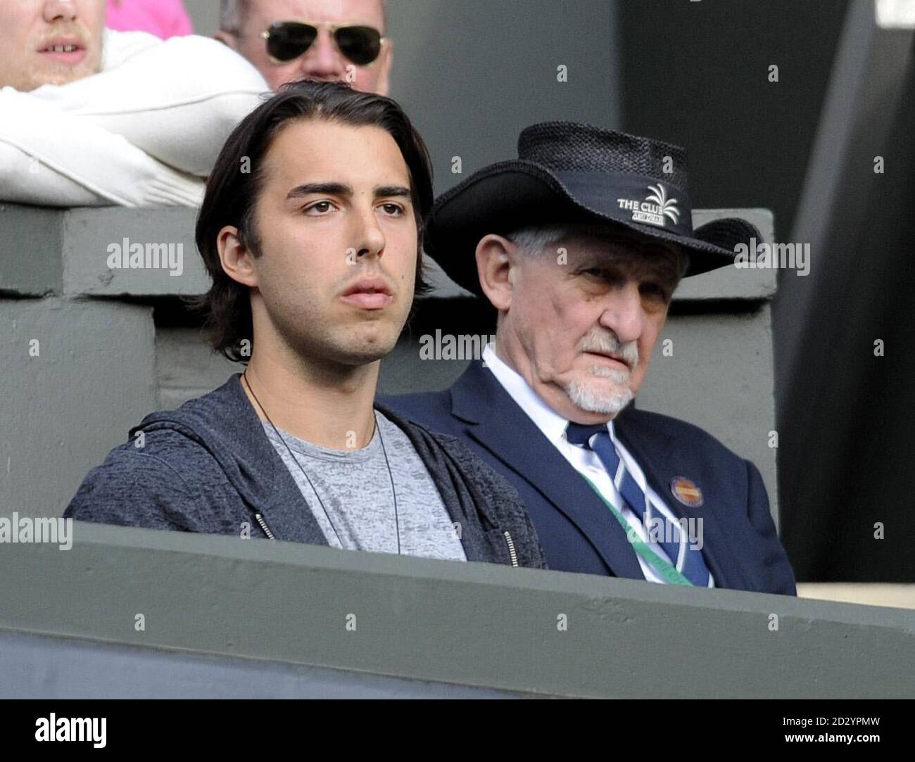 Sasha Vujacic (left), fiance of Russia's Maria Sharapova, watches her on Centre Court during day two of the 2011 Wimbledon Championships at the All England Lawn Tennis and Croquet Club, Wimbledon. Stock Photo