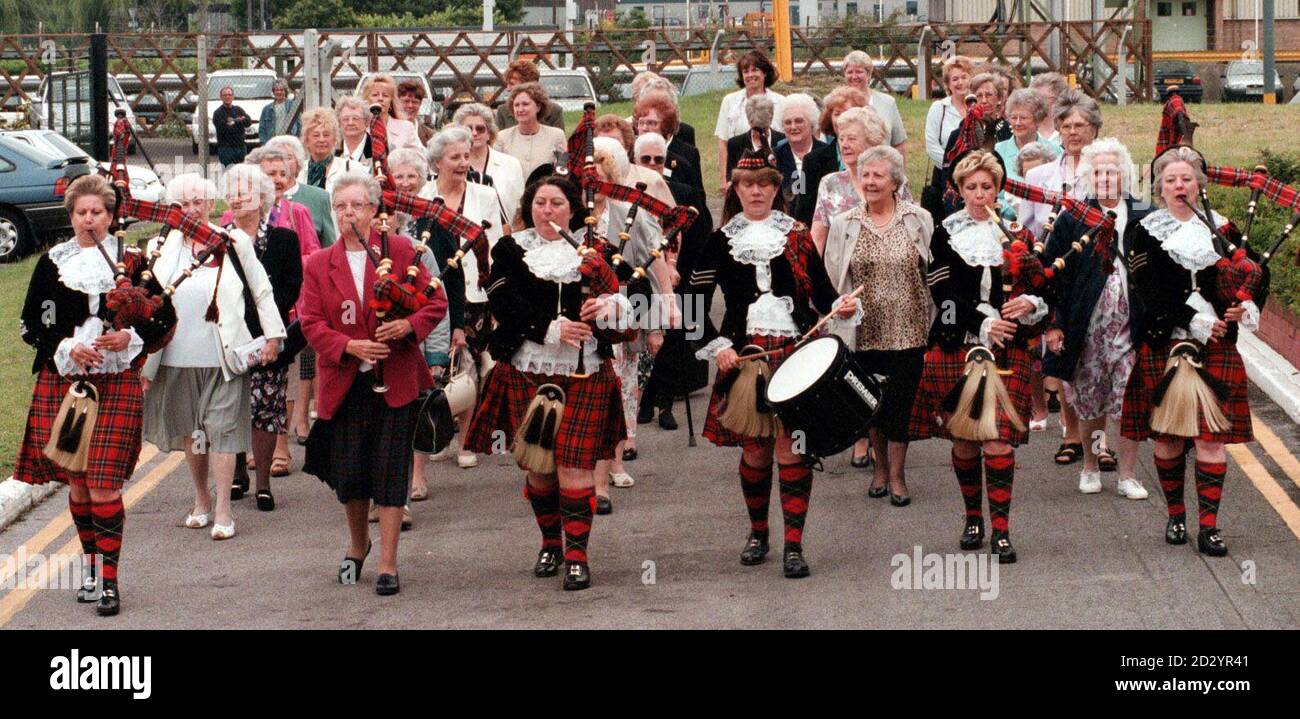 Members of the Dagenham Girl Pipers, featuring Pipe major Peggy Iris (2nd left) during today's (Thursday) reunion at the Ford Heritage Centre. Dagenham Girl Pipers, the world's first female pipe band, which charmed Hitler and entertained audiences across the globe, were reunited following a promise drawn up by Rev Joseph Waddington Graves, who founded the band in 1930 with a handful of 11-year-old girls from his Sunday school class. PA Photos. See PA story SOCIAL Pipers Stock Photo