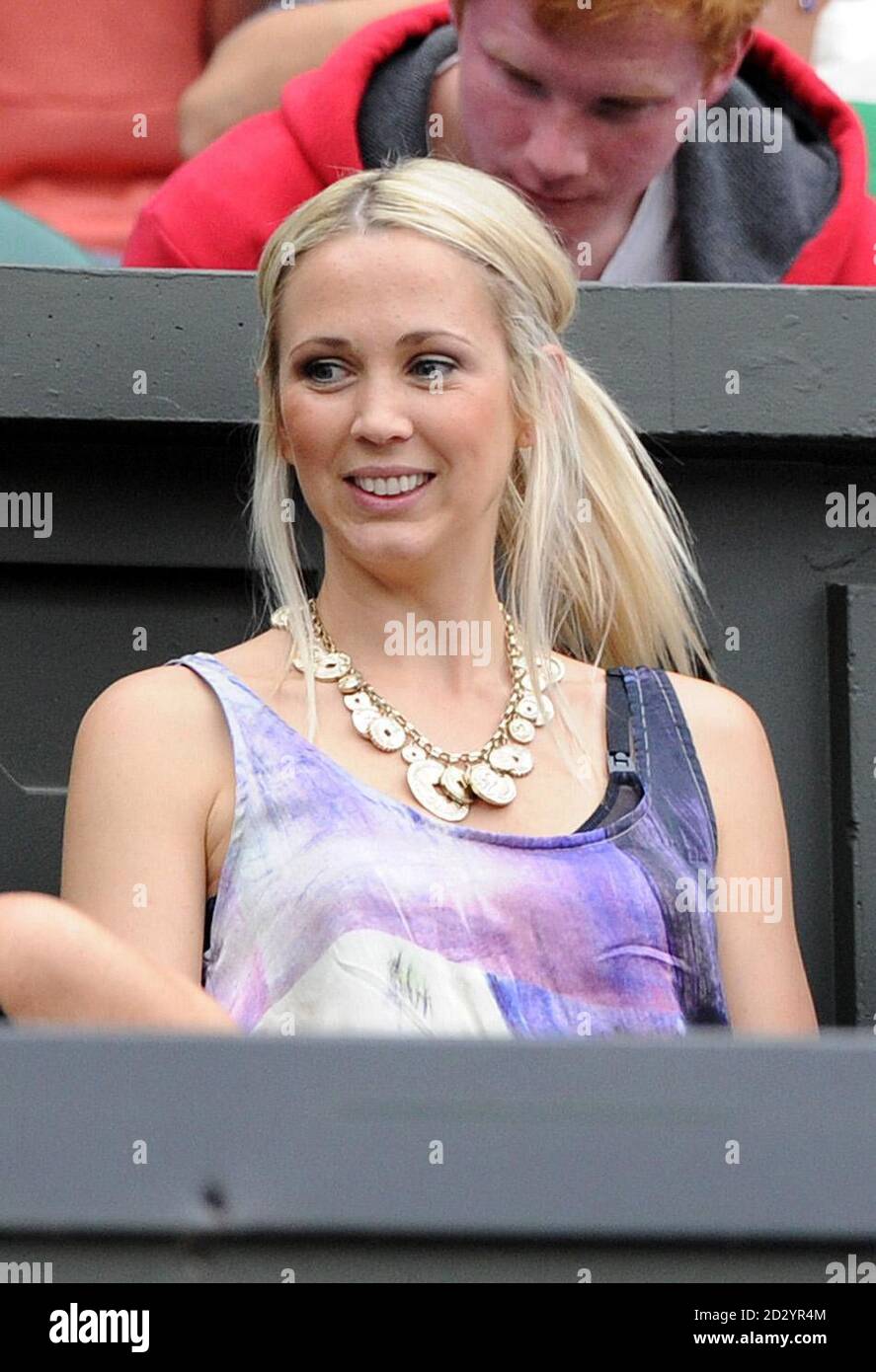 Bec Cartwright, wife of Australia's Lleyton Hewitt, watches him on Centre Court during day four of the 2011 Wimbledon Championships at the All England Lawn Tennis and Croquet Club, Wimbledon. Stock Photo