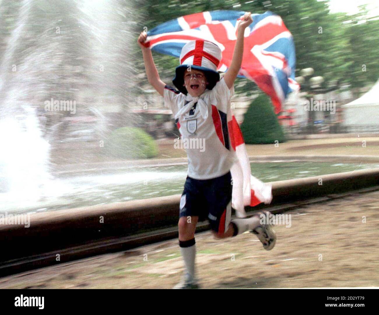 Jamie Moore, age 11, from Ramsgate, Kent, flies the flag for England in the build up to the crucial game tonight (Tuesday) against Argentina, in St Etienne. PHOTO OWEN HUMPHREYS/PA Stock Photo
