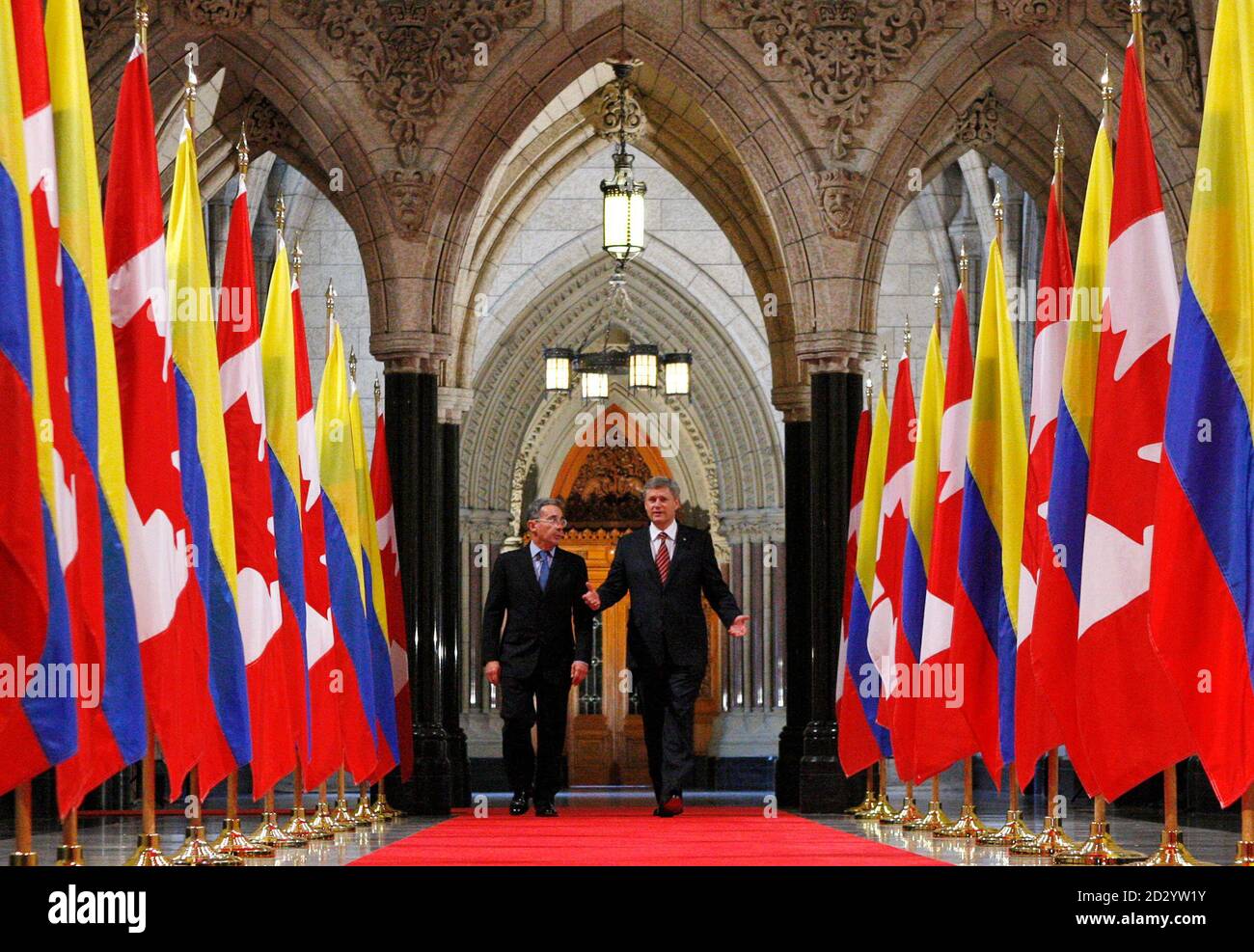 Canada's Prime Minister Stephen Harper (R) and Colombia's President Alvaro Uribe walk down the Hall of Honour on Parliament Hill in Ottawa June 10, 2009.       REUTERS/Chris Wattie       (CANADA POLITICS) Stock Photo