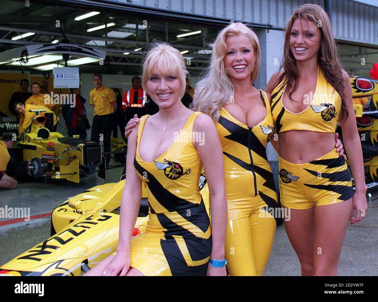 Models Emma Noble, Melinda Messenger and Jordan pose with today (Sunday) ahead of the start of the British Grand Prix. Photo by Owen Humphreys/PA Stock Photo