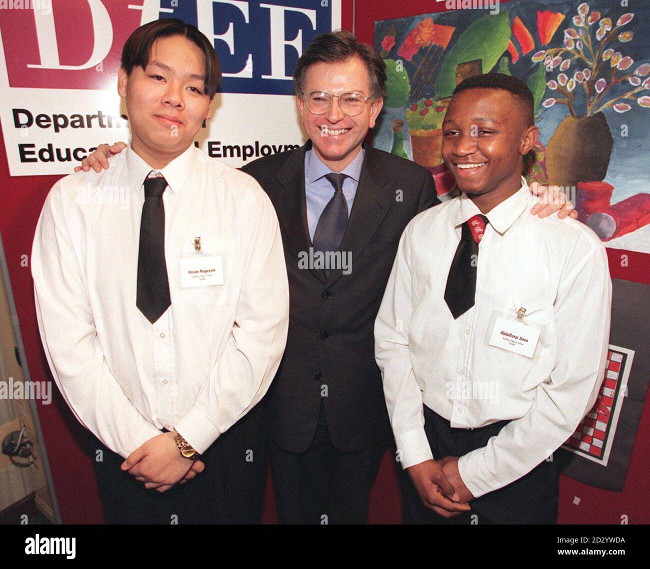 School Standards Minister Stephen Byers meets 15-year-olds Havan Nguyen (left) and Abdulbatai Amoo, from the Geoffrey Chaucer School, London, on the House of Commons terrace, where the minister threw a party today (Monday) for 73 schools from across England to celebrate their triumph over failure after being 'named and shamed' by the government. See PA story EDUCATION Schools. Photo by Peter Jordan/PA Stock Photo