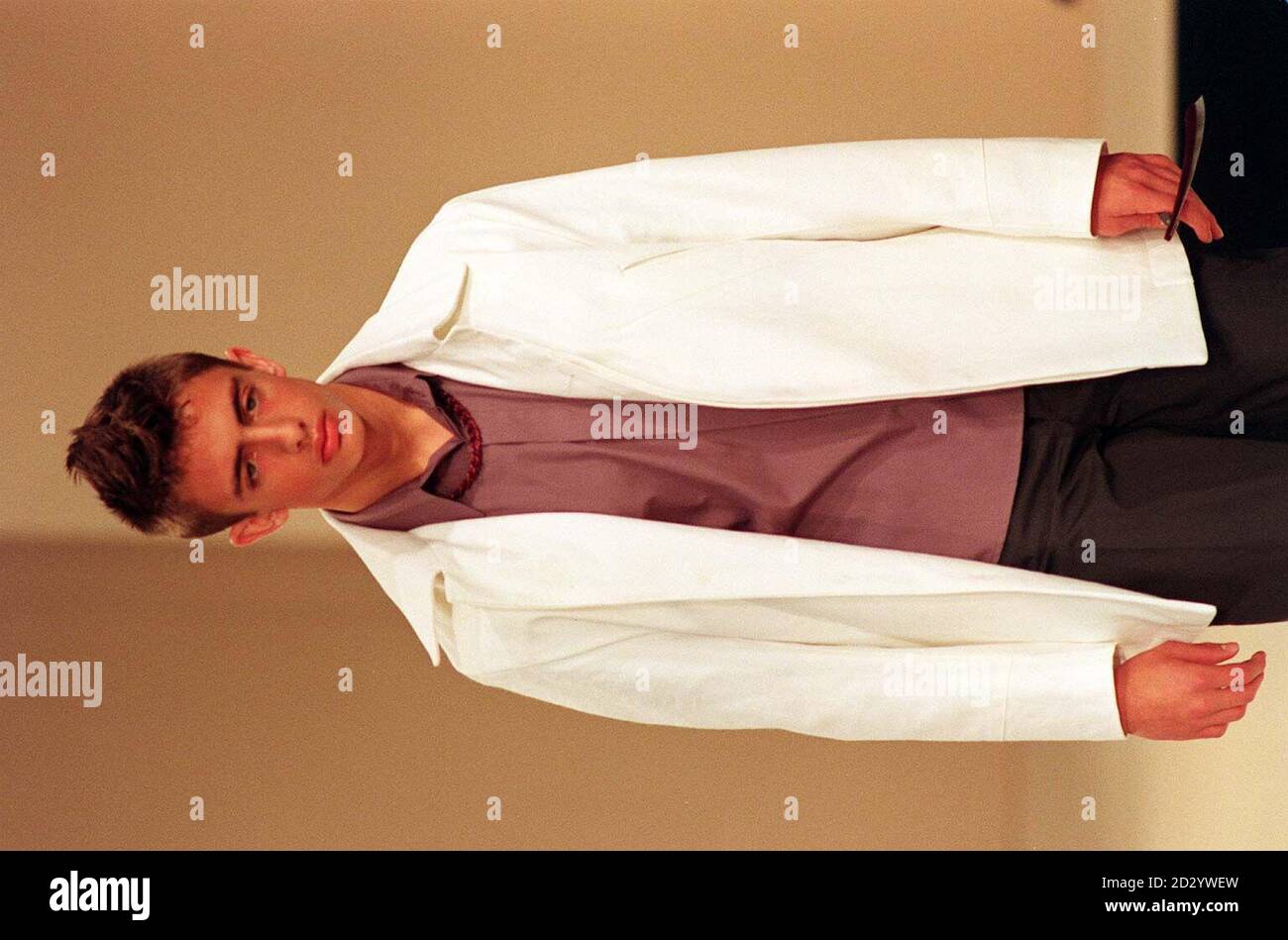 A model sports an outfit, including a beaded necklace from the summer 1999 collection by Neil Adams during London Mens Fashion Week today (Tuesday).  Photo by Stefan Rousseau/PA. Stock Photo