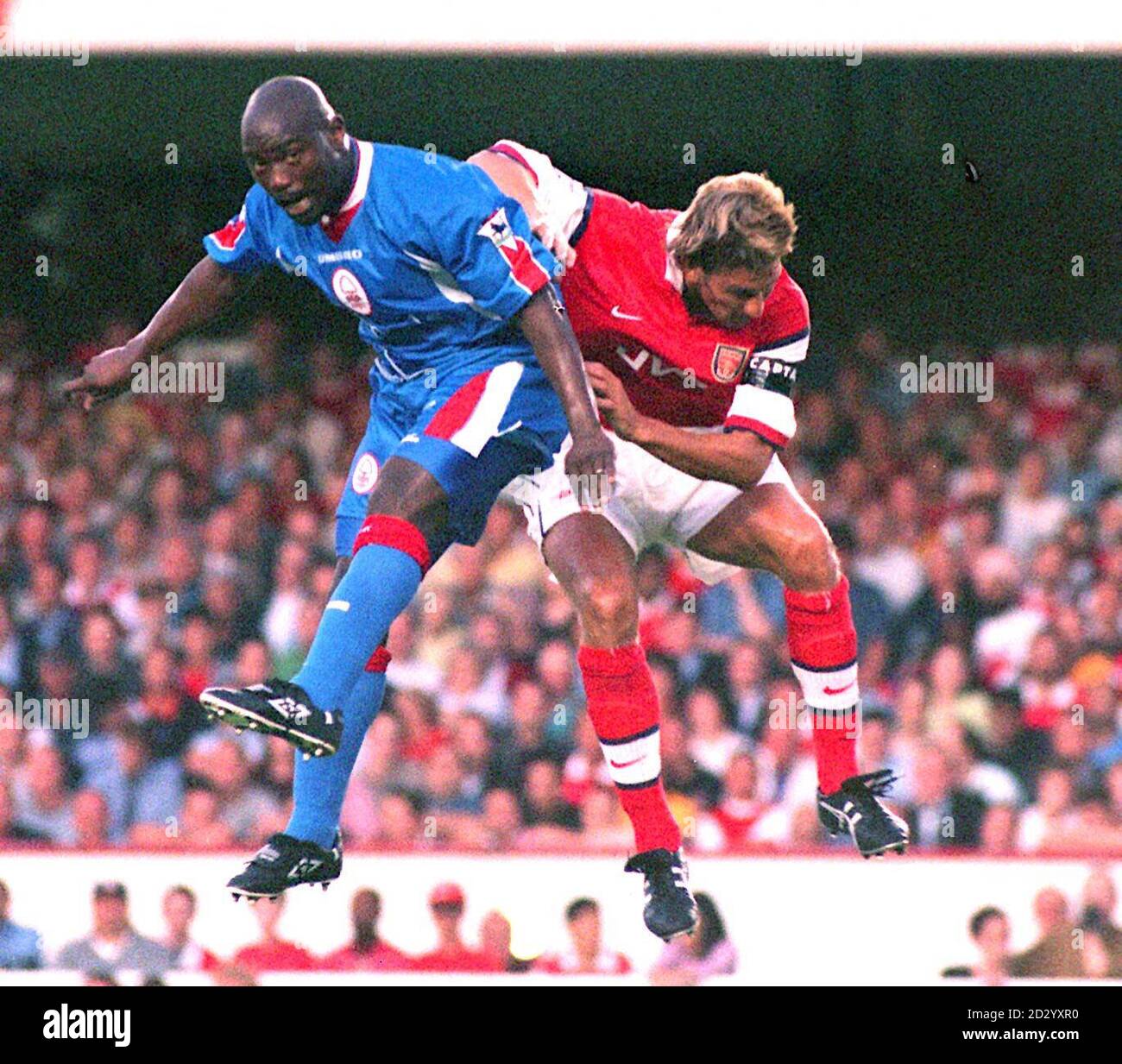 THIS PICTURE CAN ONLY BE USED WITHIN THE CONTEXT OF AN EDITORIAL FEATURE. Arsenal's Tony Adam's (right) clears from Nottingham Forest's Jean-Claude Darchville during tonight's FA Carling Premiership match at Highbury. Photo by Tony Harris/PA. Stock Photo