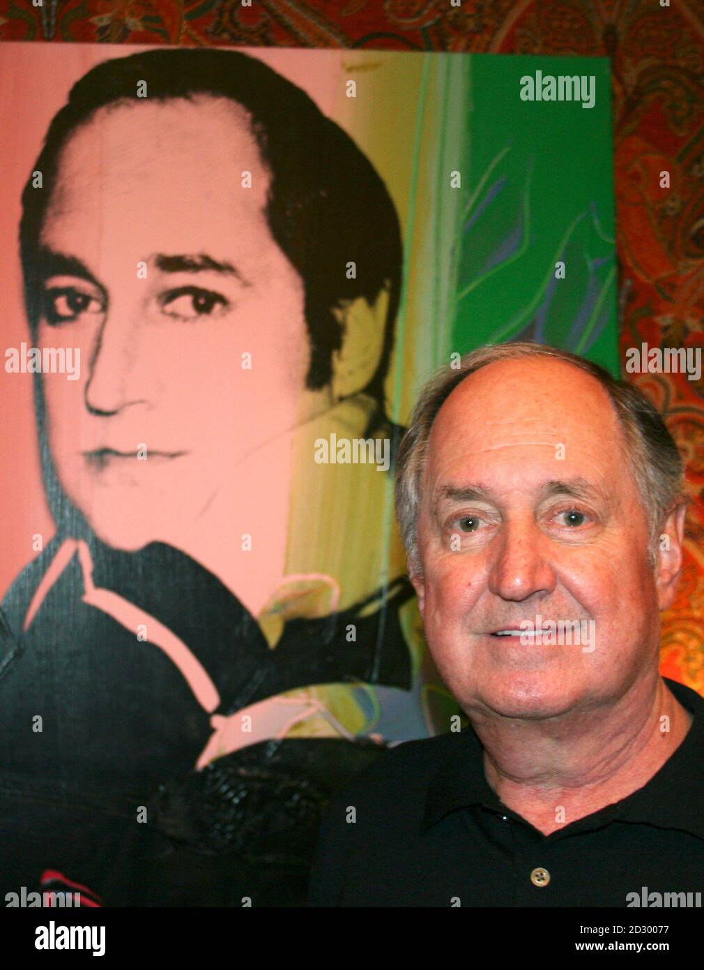 Singer Neil Sedaka poses with an Andy Warhol painting of himself at his apartment in New York January 19, 2010. When Tin Pan Alley ruled the world of pop music, Sedaka was one of the songwriters churning out hits in New York's legendary Brill Building that helped pre-Beatles teenagers go to the hop, fall in love and break up. Now, 50 years later, with over 1,000 songs to his credit, he has recorded 'The Music of My Life,' an album of original songs he performs that hit stores on January 26, 2010.      REUTERS/Steve James (UNITED STATES - Tags: ENTERTAINMENT) Stock Photo