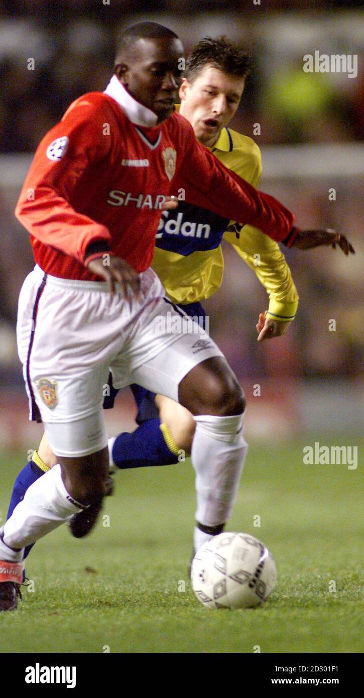 Manchester United's Dwight Yorke (left) charges forward with Brondby's Ruban Bagger in pursuit during the Champion's League clash Old Trafford tonight (Wednesday). Photo by Owen Humphreys/PA. Stock Photo