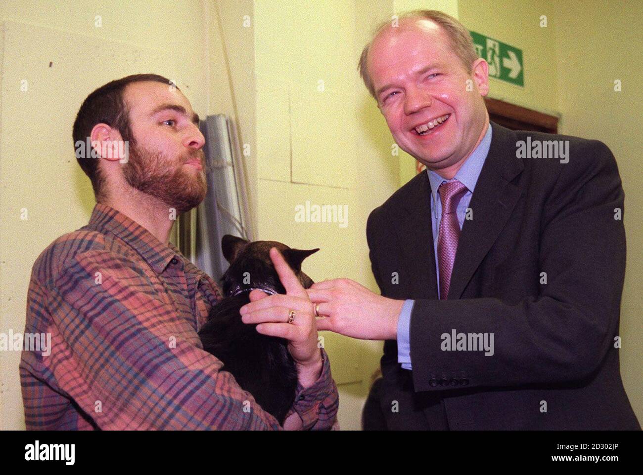 Oppostion leader William Hague meets Nicholas (a homeless man at the Cold Weather Shelter) and his dog Wolf at the Crisis Cold Weather Centre in central London today (Tuesday). Picture Abbie Trayler-Smith/PA Stock Photo