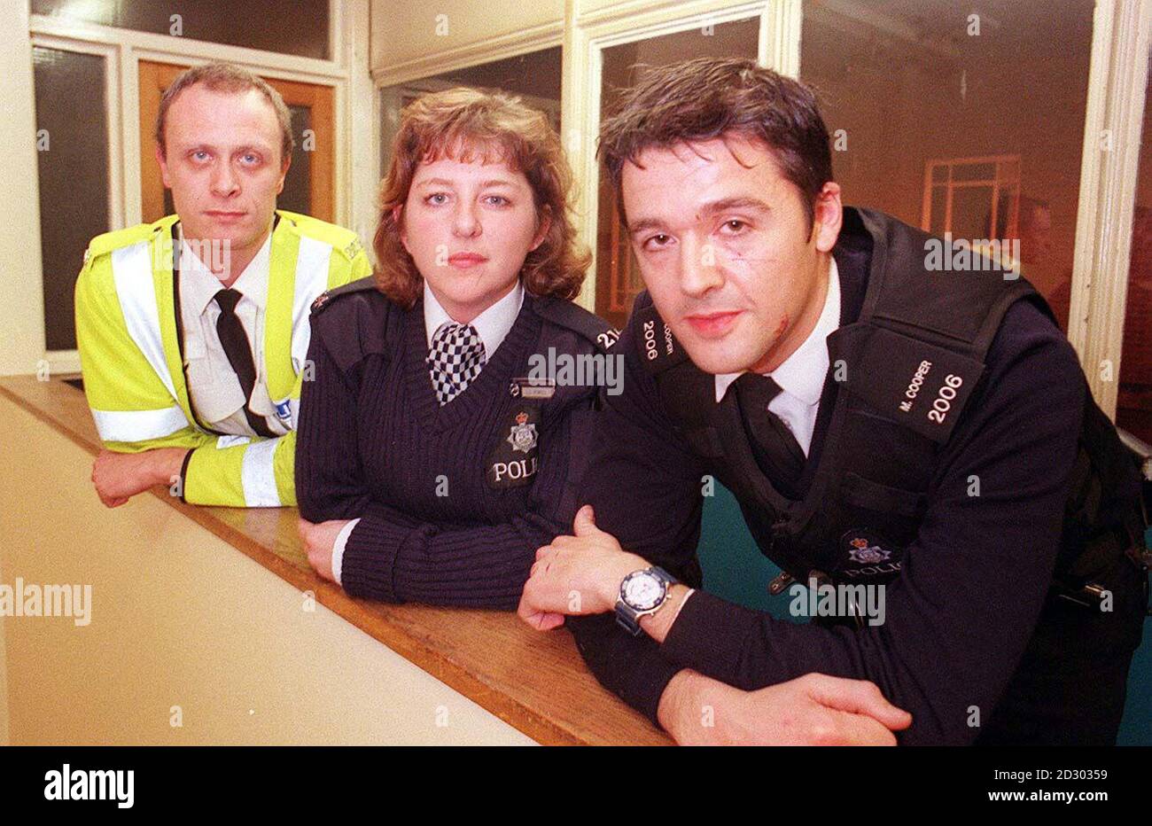 Police officers Chris Fearn (left), Lisa Powell and Mick Cooper, who were involved in the incident at Dalbury, Derbyshire Monday December 7, 1998 when a tractor driven by an angry far mer went on the rampage damaging cars, a caravan, walls and a fire engine. Police used CS gas in an attempt to disable the driver, but the vehicle was only stopped after armed officers fired shots at its tyres. A local man is being questioned by police over the incident. See PA story POLICE Tractor. PA Photo: Derby Evening Telegraph/Stuart Wilde. Stock Photo