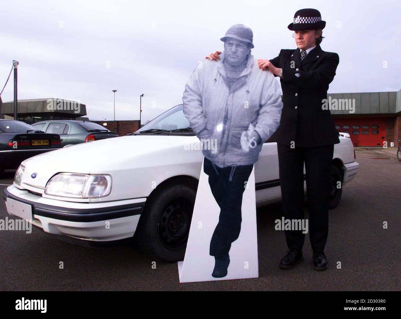 Staffordshire Police working on Operation Tornado held a press conference about armed robberies of building societies across central and northern england and north wales. They released a life size cardboard cut-out of the suspect and details of his car. Stock Photo