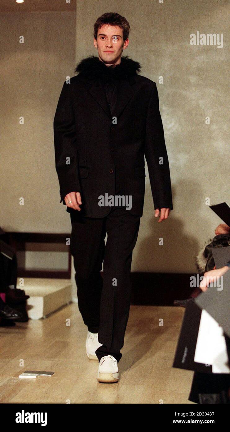 A model presents a dark grey suit and shirt designed by John Rocha, during  the catwalk presentation of his collection during London Men's Fashion Week  Stock Photo - Alamy