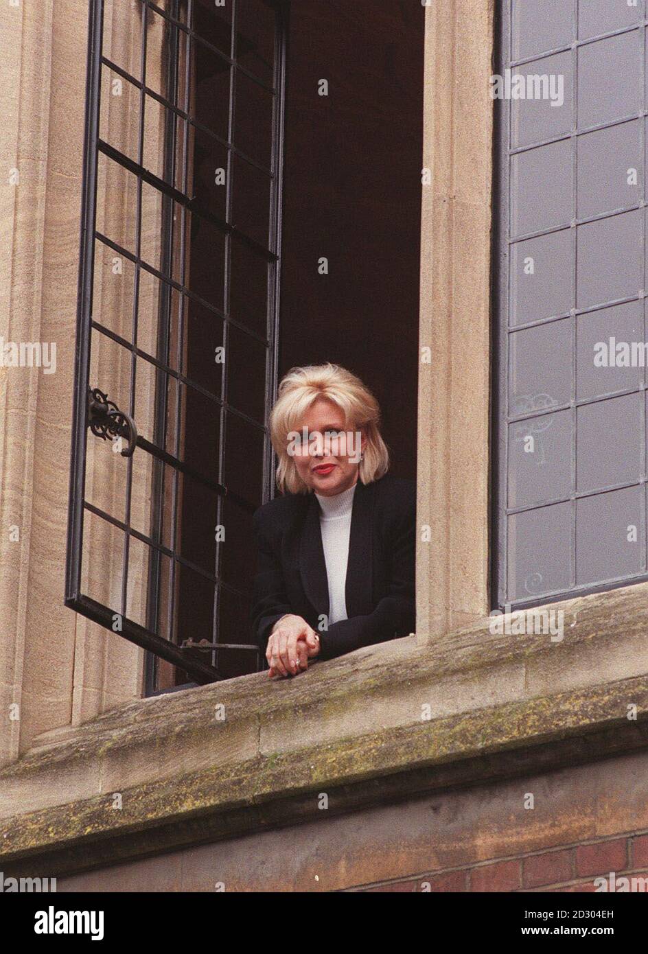 Gennifer Flowers, who had an infamous liaison with US President Bill Clinton, smiles from a window at Oxford University , where she will warn female students against embarking on affairs with married men. Stock Photo