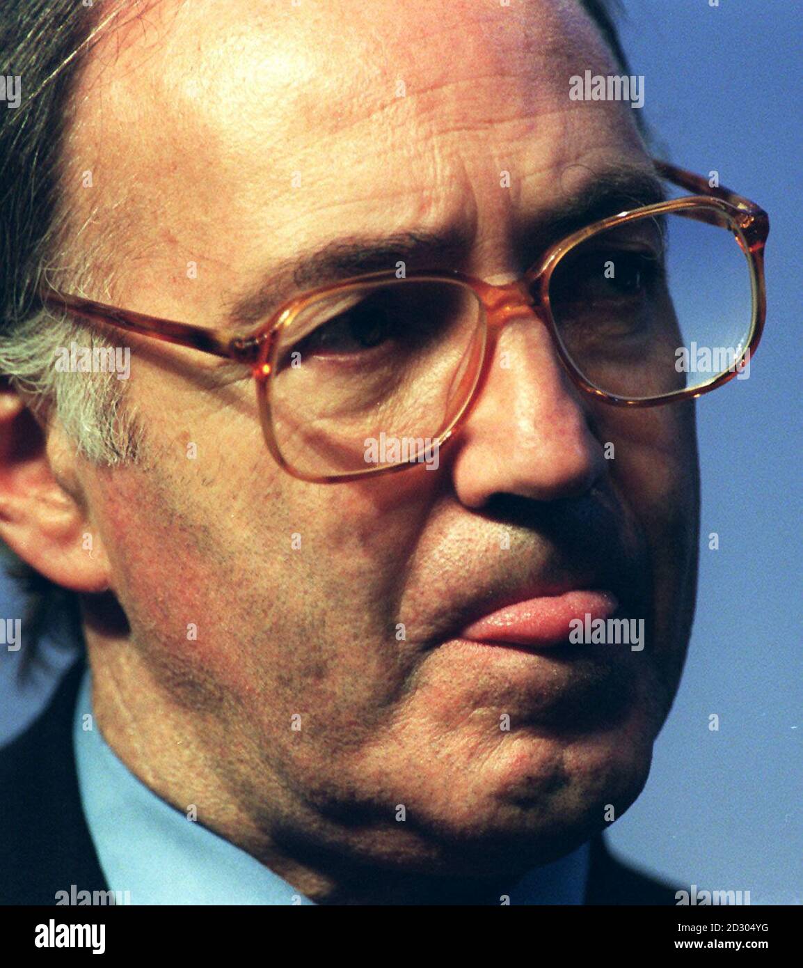 Shadow Foreign Secretary, Michael Howard, listens as the Shadow Home Secretary Dr Brian Mawhinney delivers his keynote speech during the debate on home affairs at the Conservative Party Conference. 9/3/99: Howard announces intention to return to backbenches. Stock Photo