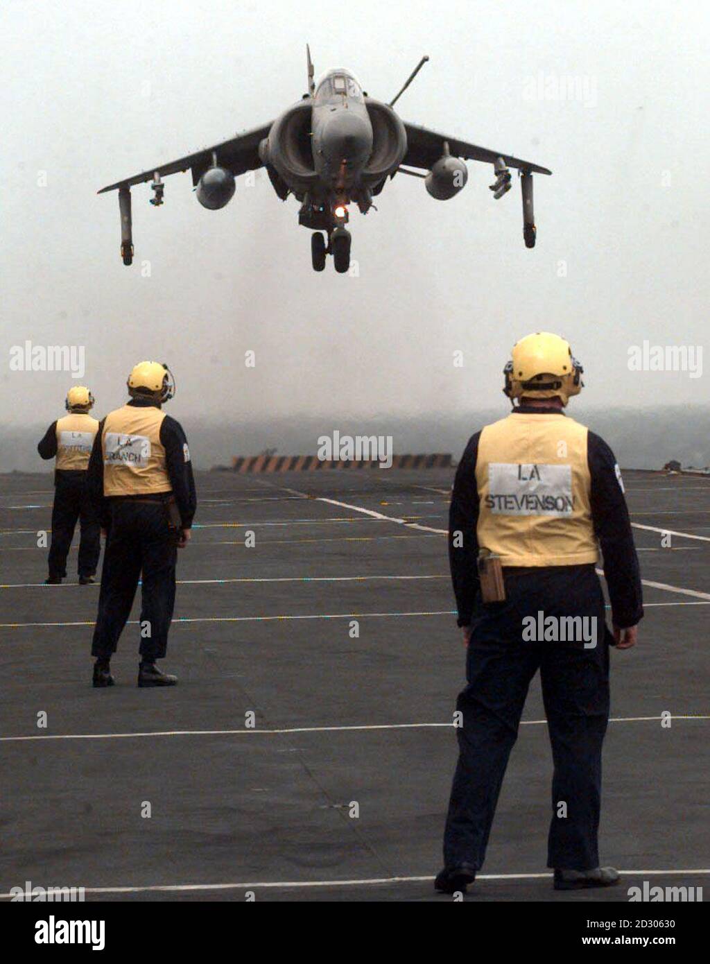 An  FA2 Sea Harrier landing on the Deck of HMS Invincible aircraft carrier as it joins the NATO forces off the Balkan coast. The aircraft will boost the British contribution to airstrikes against Serbian military targets.    *16/04/1999 of an FA2 Sea Harrier landing on the Deck of HMS Invincible aircraft carrier. A similar plane was coming into land at Royal Navy Air Station Yeovilton, Somerset Monday October 8, 2001 but ended up in the River Yeo close to base. The plane failed to stop on the runway and the pilot was forced to eject. The plane ran off the end of the runway and ended up submerg Stock Photo