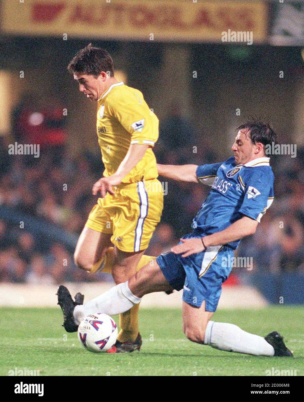 This picture may only be used within the context of an editorial feature. Leed's Harry Kewell (left) is tackled from behind by Chelsea's Albert Ferrer, duringtheir FA Premiership match at Stamford Bridge, London. Stock Photo