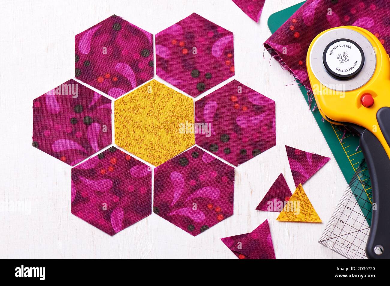 Preparation of hexagon pieces of fabric for sewing a quilt Grandmother