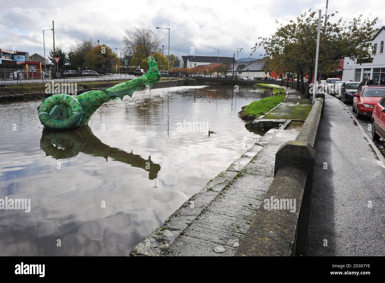 A Hallowe'en decoration in the canal in Newry, County Down succombs to the bad weather. Stock Photo