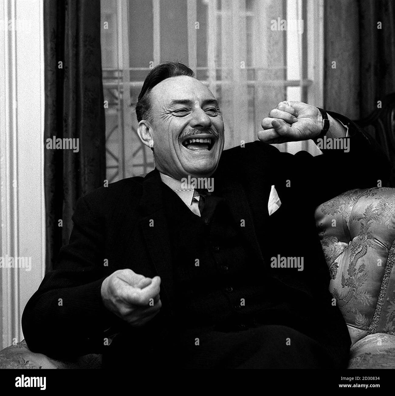 Enoch Powell laughs during an exclusive interview with a Press Association reporter at his London home. Stock Photo