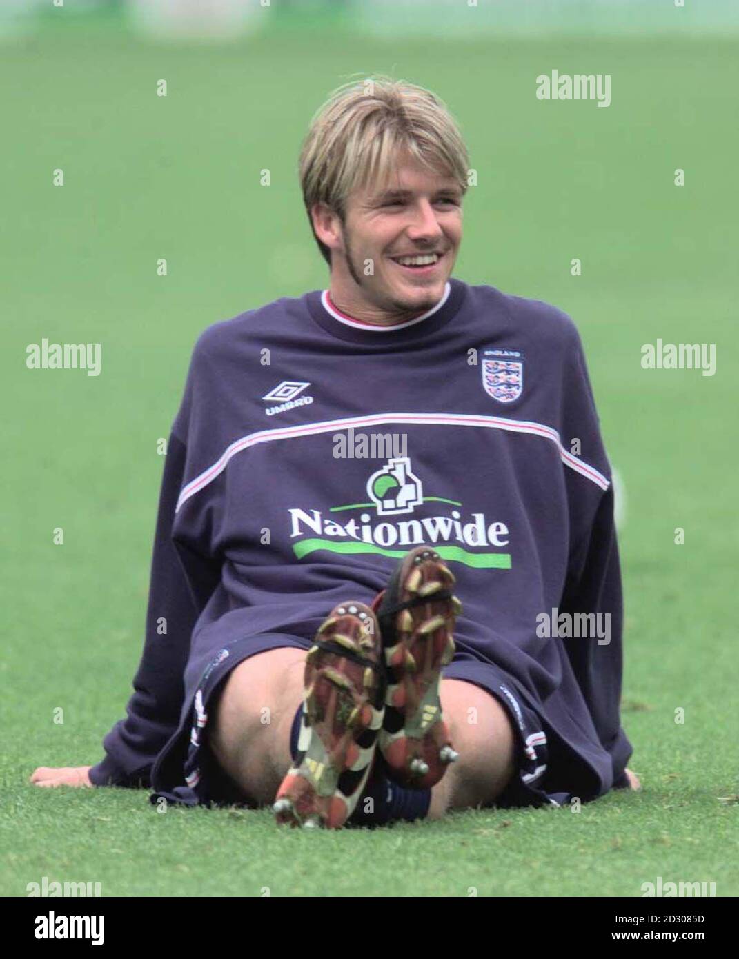 This picture may only be used in the context of an editorial feature. England footballer David Beckham relaxes, during a Wembley training session prior to their Euro 2000 qualifier football match against Sweden. Stock Photo