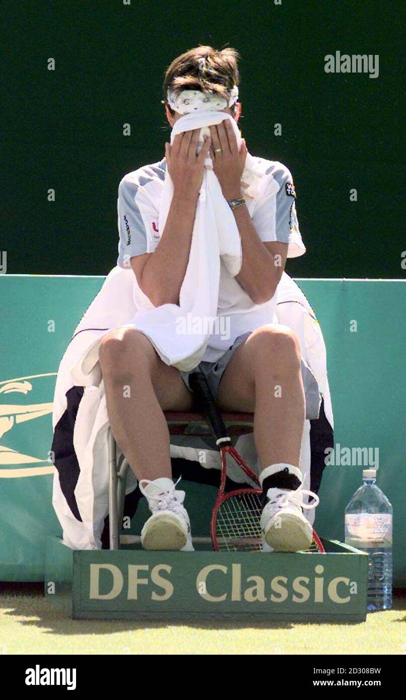 England's number one women's tennis player Sam Smith wipes her face with a towel at a break, during her 6-2 6-3  first round defeat at the hands of American Kristina Brandi at the DFS Classic tennis championship in Edgbaston. Stock Photo