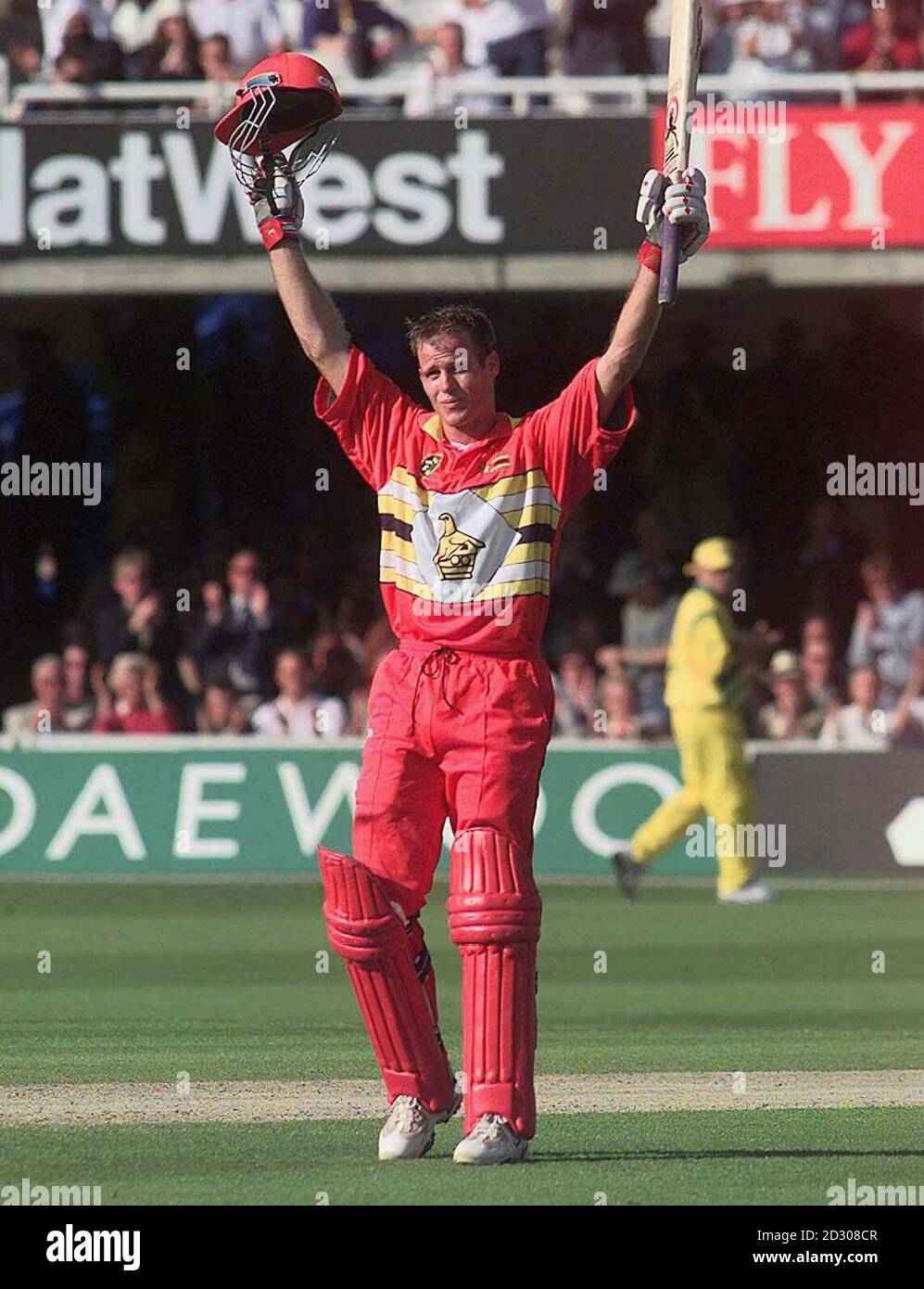 Neil Johnson of Zimbabwe acknowledges the crowd as he reaches his century against Australia during their Super Six cricket World Cup match at Lords, in London. Stock Photo