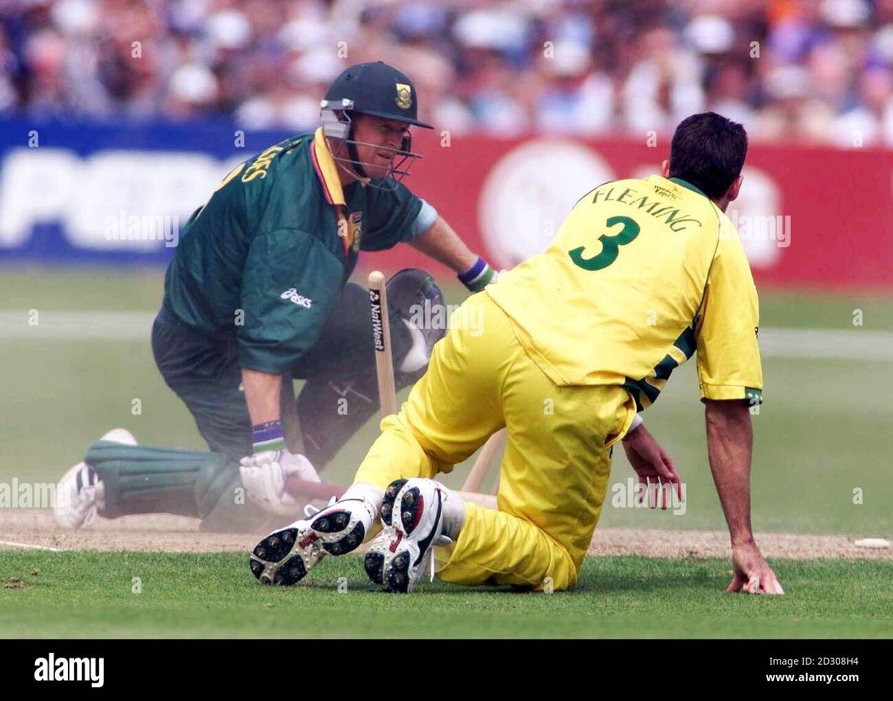 South Africa's Jonty Rhodes (L) clashes with Australia's Damien Fleming