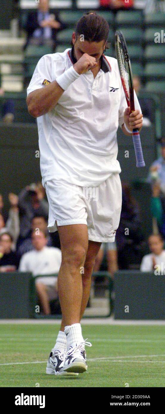 No Commercial Use: Australia's Pat Rafter reacts after defeating Sweden's Jonas Bjorkman, 6-2 7-6 6-7 6-2, on Court One, at the Wimbledon Tennis Championships, London. Stock Photo
