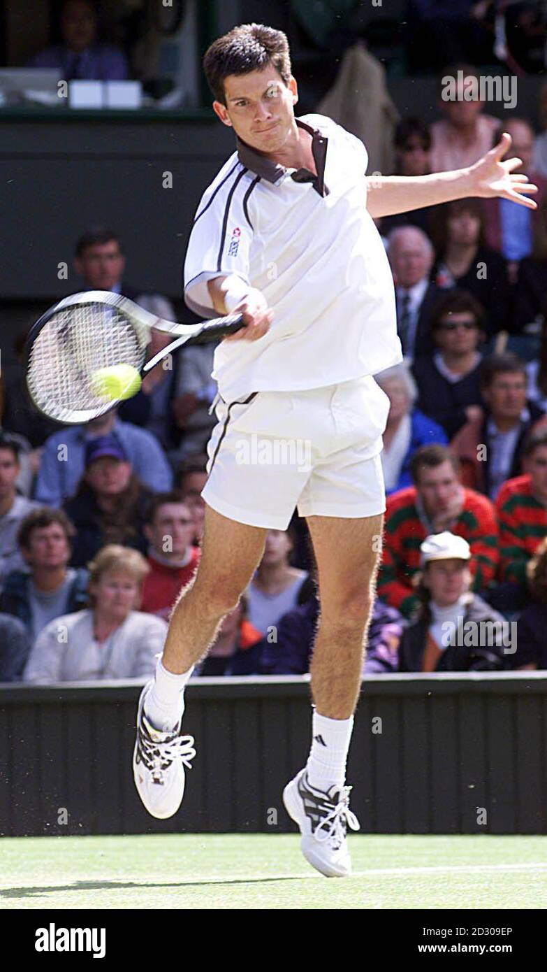 No Commercial Use: Tim Henman in action during his fourth-round match against America's Jim Courier on Centre Court at Wimbledon. Stock Photo