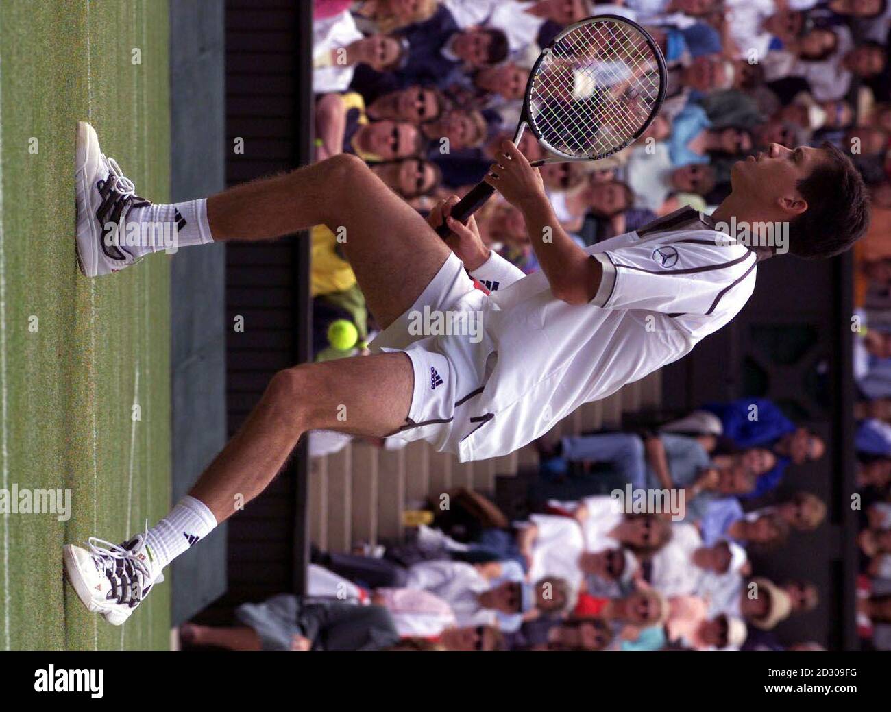 No Commercial Use: Britain's Tim Henman loses sight of the ball during his fourth-round against America's Jim Courier on Centre Court at the 1999 Wimbledon tennis championship. Stock Photo