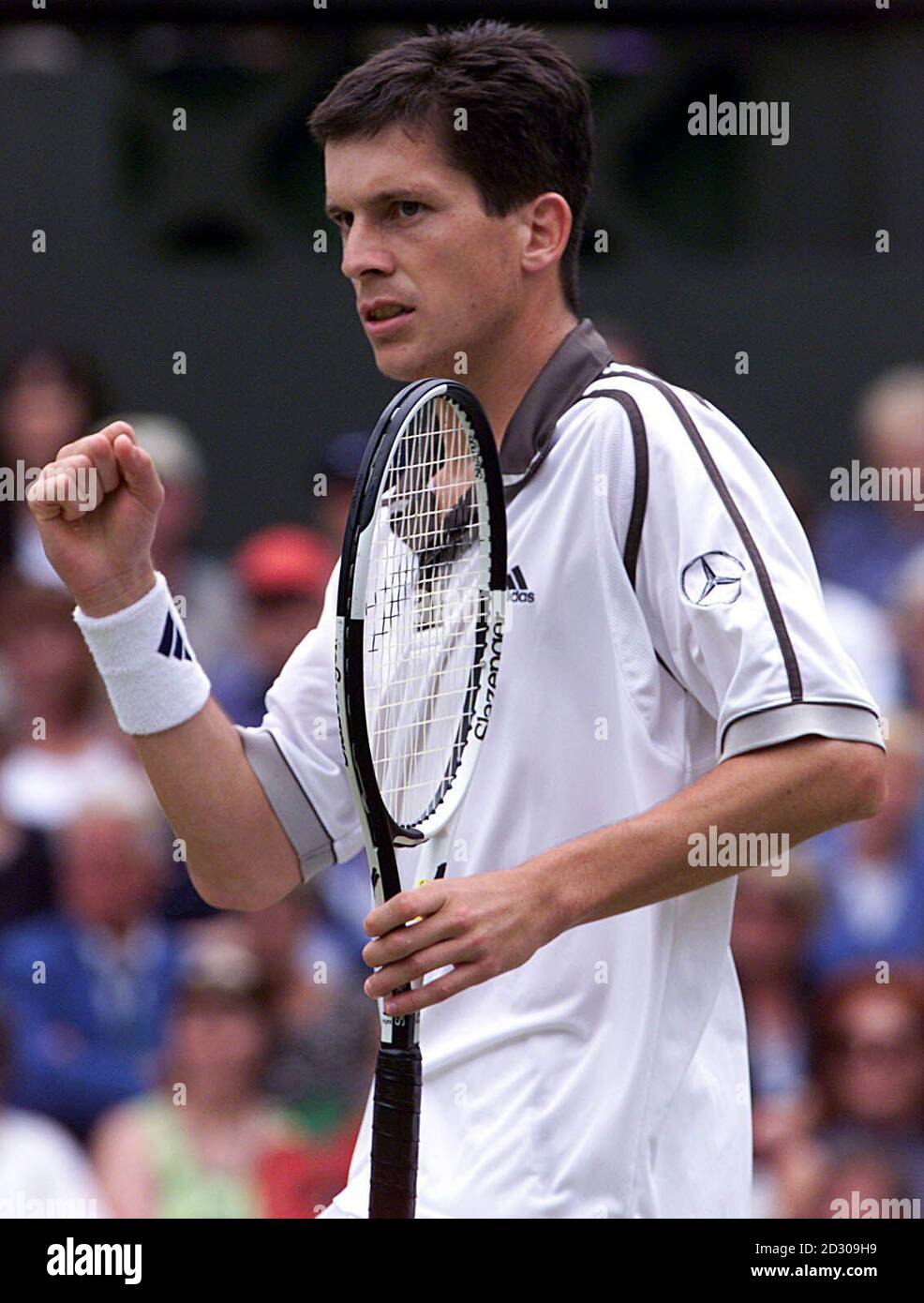 No commercial use. Tim Henman celebrates winning his match against American Jim Courier, during the 1999 Wimbledon tennis Championships. Stock Photo