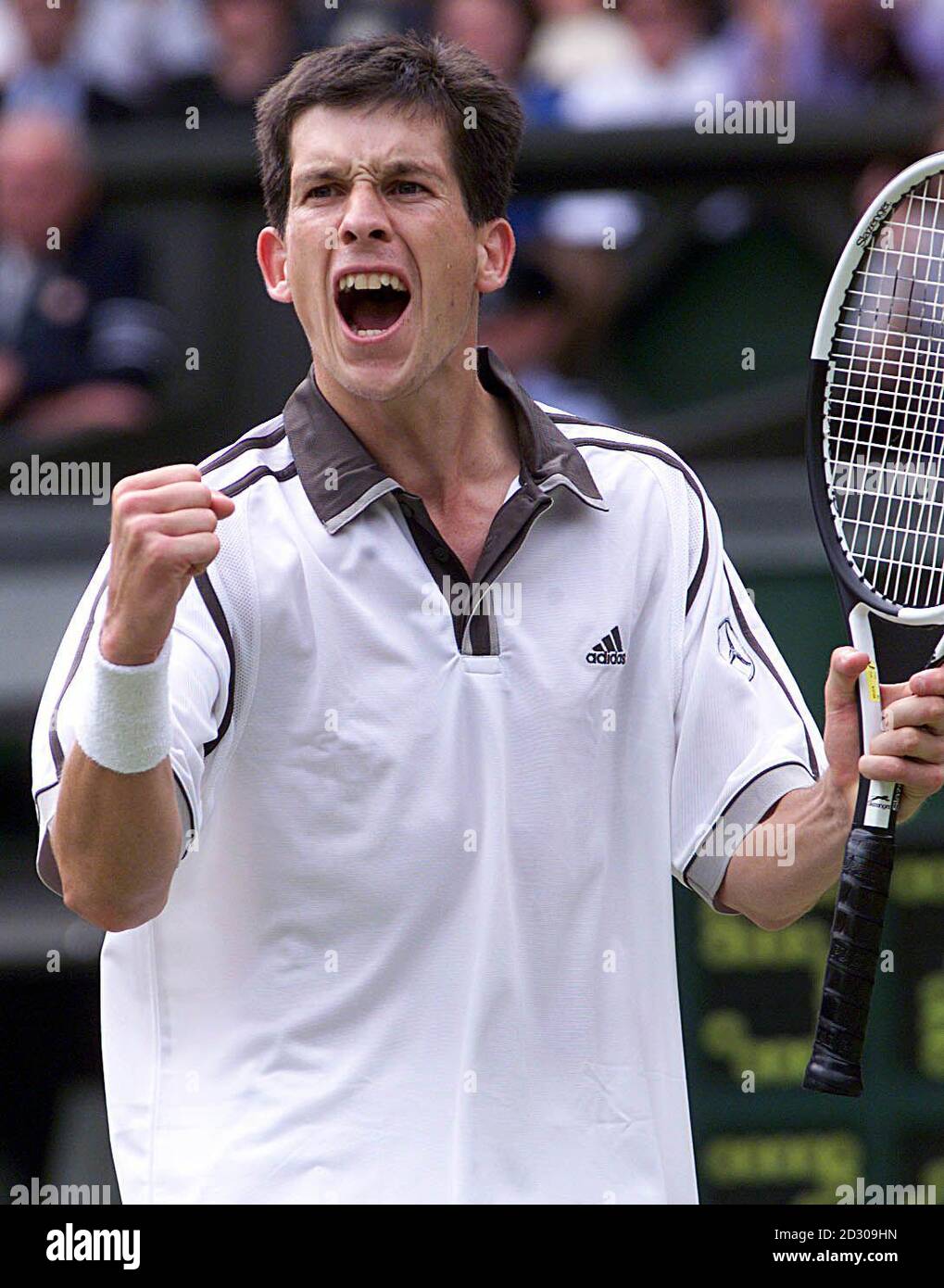 No Commercial Use: Tim Henman celebrates after defeating American Jim Courier  4-6  7-5  7-5  6-7  9-7  at the Wimbledon Tennis Championships.  Stock Photo