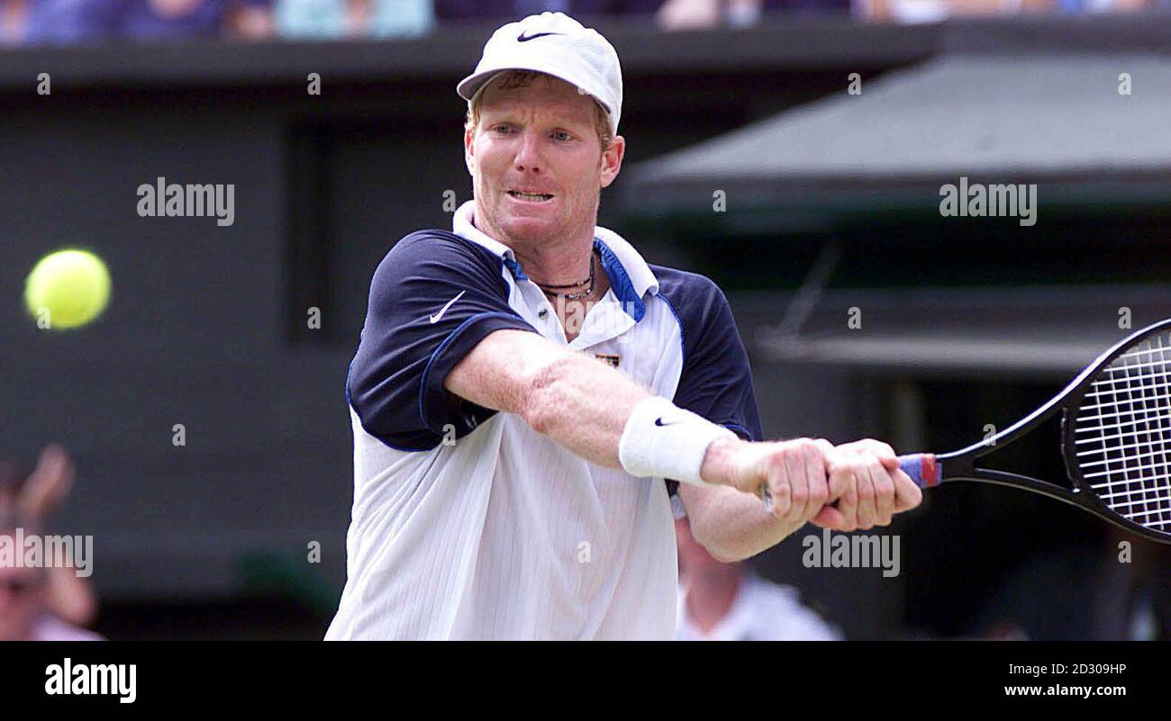 No Commercial Use :American Jim Courier in action during his match against Tim Henman at Wimbledon. Henman defeated Courier 4-6 7-5 7-5 6-7 9-7. Stock Photo