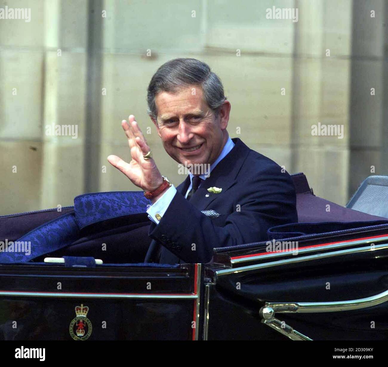The Prince of Wales waves to the crowd while leaving Holyrood House in Edinburgh for the State Opening of Scottish Parliment. Stock Photo