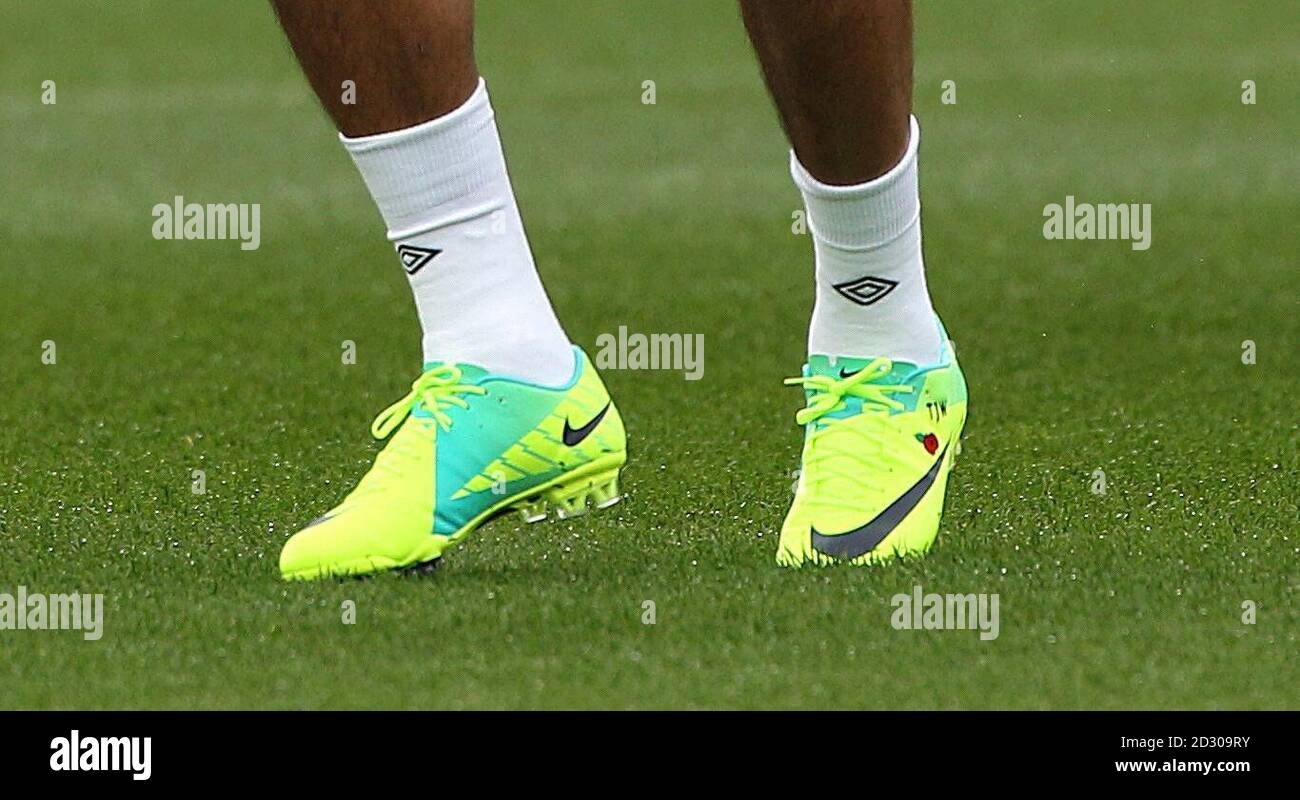 BEST QUALITY AVAILABLE* A view of Theo Walcott's Nike boots with a poppy on  during the training session at London Colney, Hertfordshire Stock Photo -  Alamy