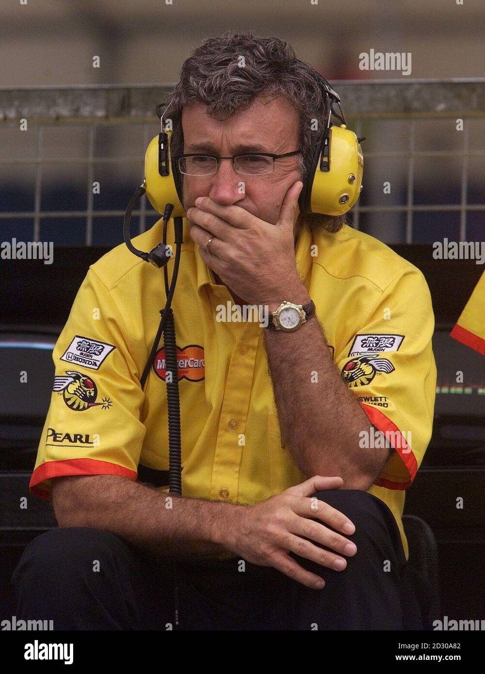 Jordan team boss Eddie Jordan takes a moment to think as he watches practice from the pits at Silverstone ahead of the British Grand Prix Stock Photo Alamy