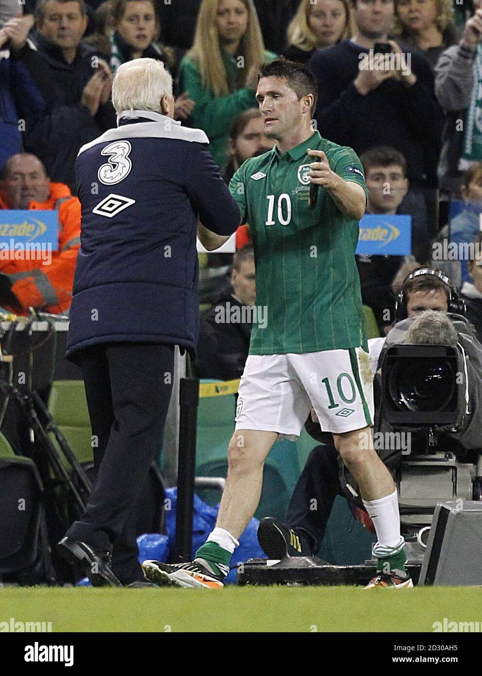 Ireland's Robbie Keane shakes hands with his manager Giovanni Trapattoni after being substituted Stock Photo